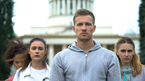 istock Protesters angrily looking camera, no gun violence, weapon control legislation 1183327156