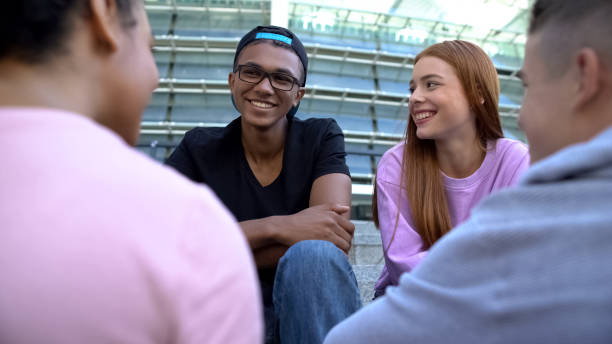 istock Multiethnic teen couples communicating outdoors, spending time together, relax 1183327667