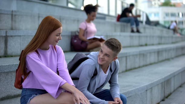 High school pupil getting acquainted pretty red-haired female romantic feelings High school pupil getting acquainted pretty red-haired female romantic feelings teen romance stock pictures, royalty-free photos & images