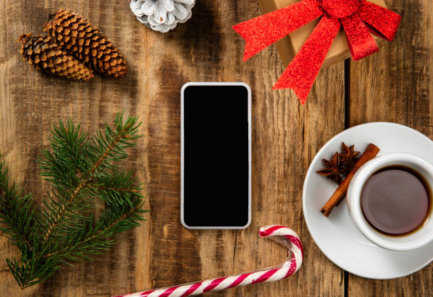 istock Mock up blank empty screen of smartphone on wooden background 1183328330