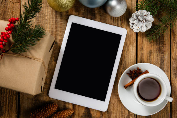 istock Mock up blank empty screen of tablet on wooden background 1183328334