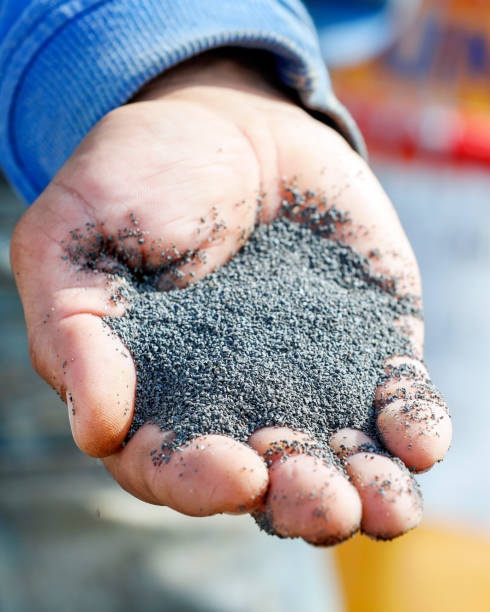 istock A handful of basalt grits for sandblasting or abrasive blasting for metal surface. 1183329305
