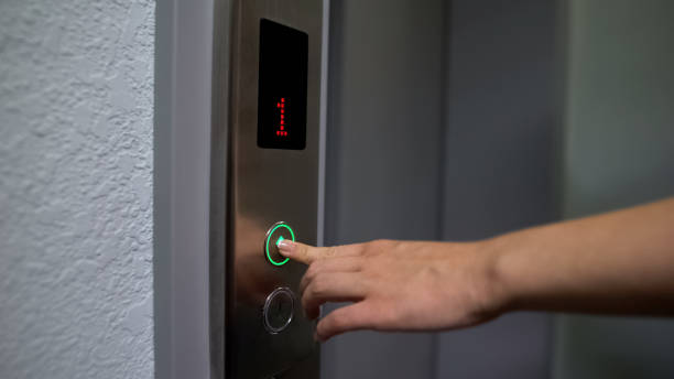 istock Female finger pressing elevator button, moving from 1 to upper floor, closeup 1183329308
