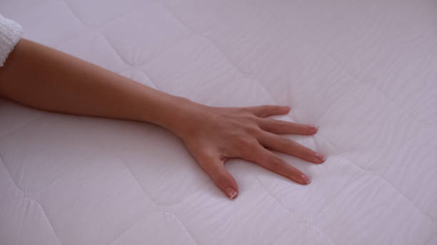 istock Hand touching mattress, testing elasticity and durability, quality sleep closeup 1183329410