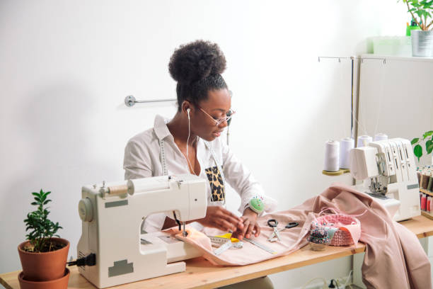 istock sewing fabric with needle at seamstress workplace 1183329637
