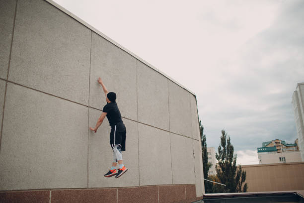 istock Parkour young man making acrobatic trick and flip jumping high 1183330465