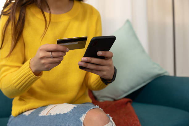 istock Young woman at home using a smartphone 1183332893