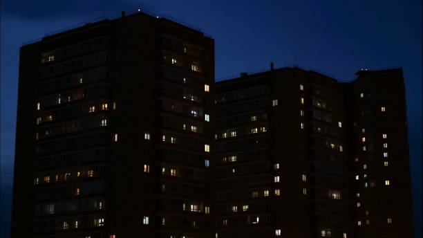 istock windows in apartment buildings at night 1183334517