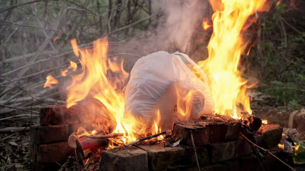 istock flame fire and smoke burning garbage waste of plastic to air pollution 1183334558