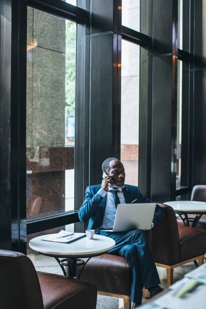 istock Businessman Workin g at Cafe 1183334643