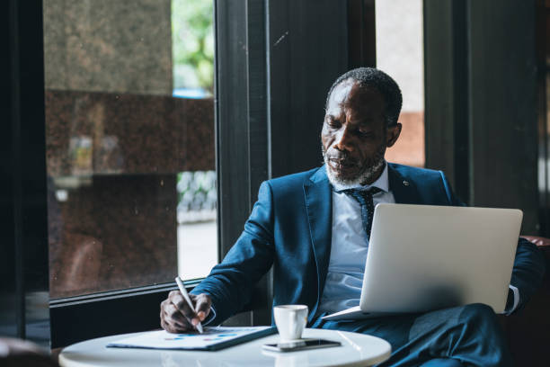 istock African Businessman Writing 1183334649