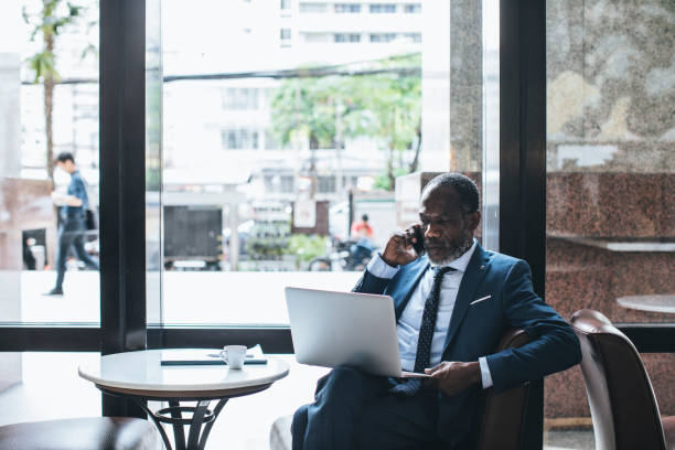 istock Businessman Workin g at Cafe 1183334660