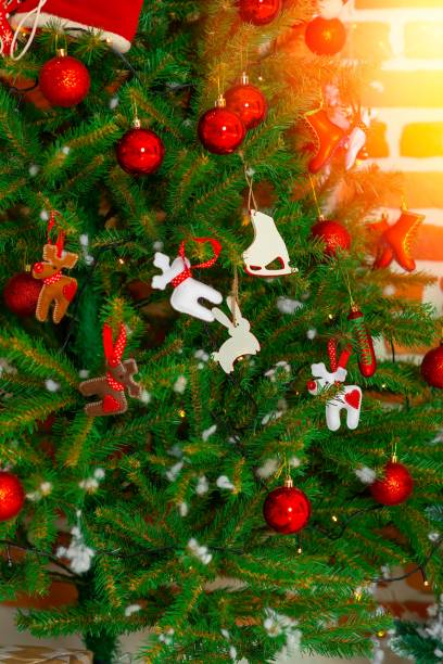 istock Happy new year 2020 concept: Abstract bokeh light bulb and blurred green Christmas tree background 1183336246