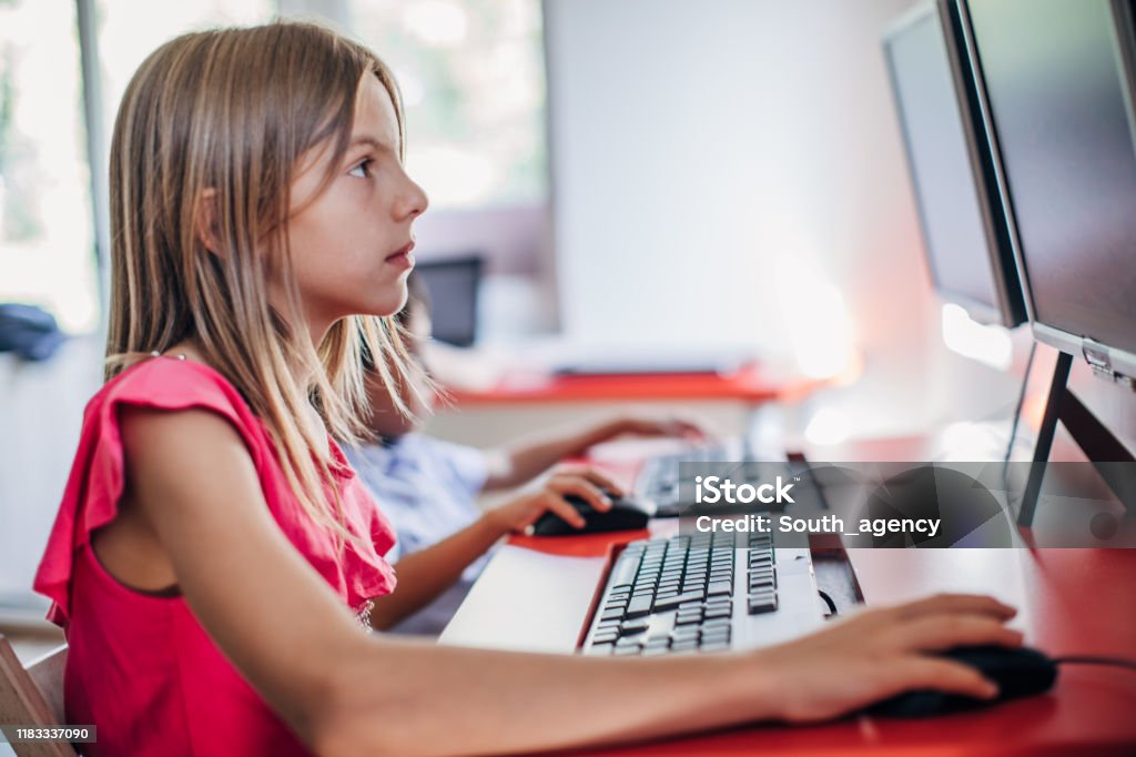 Kid Using Computer Stock Cute Girl Elementary School Using Computer Stock Photo - Download Image ...