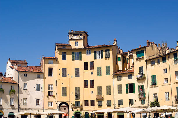 istock Lucca (Tuscany, Italy) - Old houses and blue sky 118333749