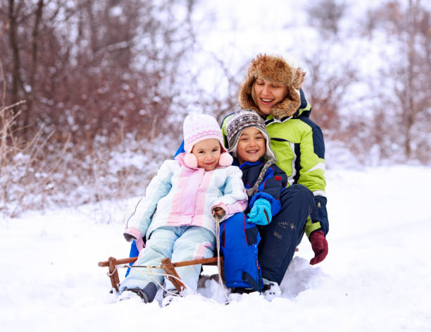 istock Family sledging on the snow 1183338304