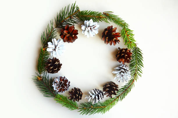 istock Christmas wreath with pine cones on white background. Flat lay, top view, copy space 1183338622