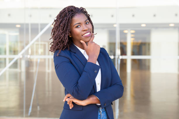istock Happy successful leader posing near office building 1183341702