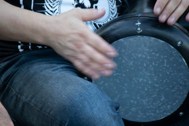 istock Percussion instrument darbuka. He pulled while he hit the darbukaya. Close-up. 1183342881