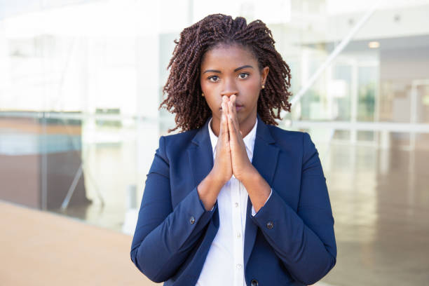 istock Stressed serious female employee posing near office 1183342891
