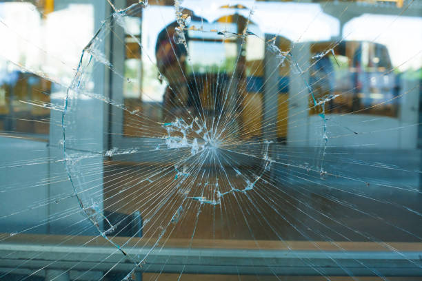 istock Broken Glass Pane. The broken glass window the shop 1183344772