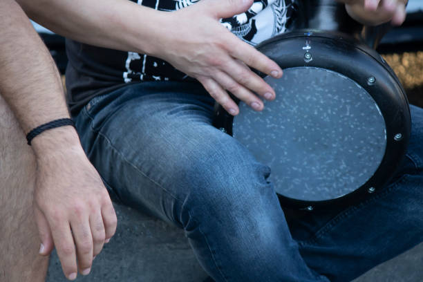 Percussion instrument darbuka. He pulled while he hit the darbukaya. Close-up.
