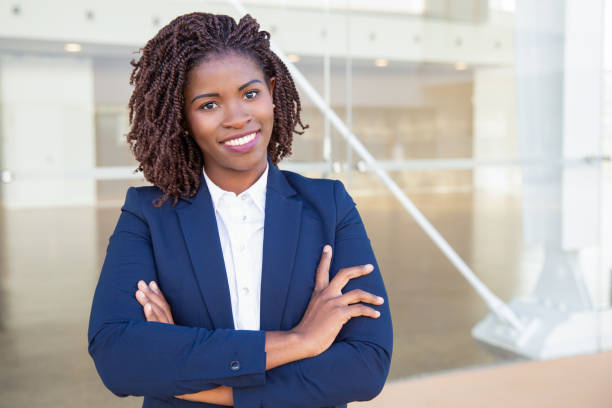 istock Happy successful professional posing near office building 1183346571