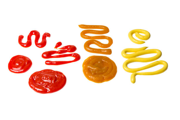 istock Ketchup and yellow sauce splashes isolated on white background. 1183347894