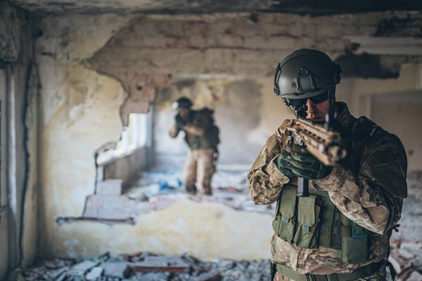 istock Two soldiers in war in abandoned building 1183349306