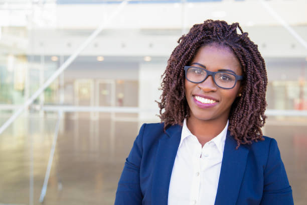 istock Happy intelligent professional posing near office building 1183349418