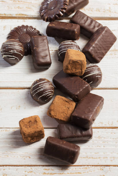 istock chocolate candy on white wooden background 1183349479