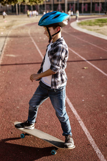istock Playful boy riding his skateboard outdoors 1183349598