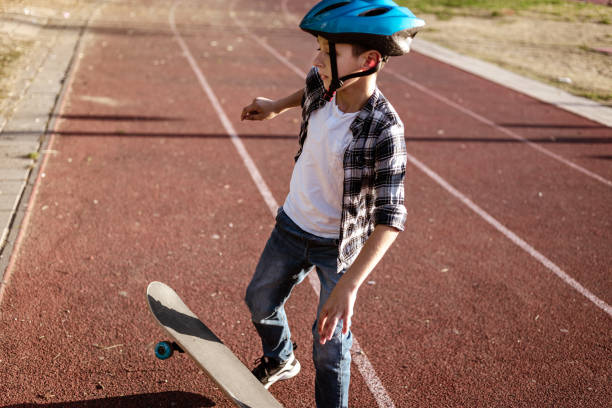 istock Playful boy riding his skateboard outdoors 1183349624