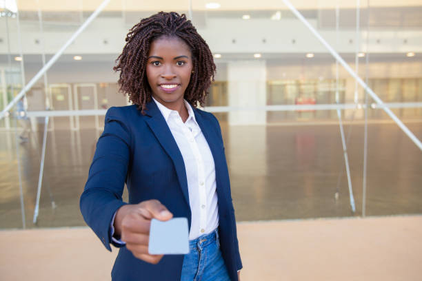 istock Happy successful agent giving name card 1183349661