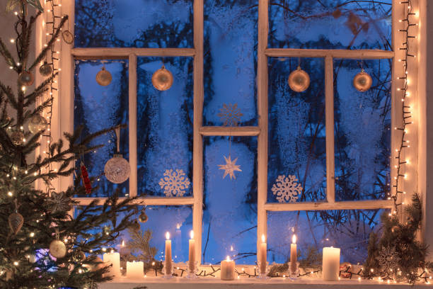 istock Christmas decorations on old wooden window 1183350481