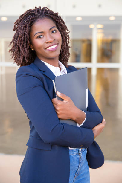 istock Happy cheerful office employee posing outside 1183350865