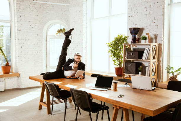 istock Businessman having fun dancing break dance in the office at work 1183352575
