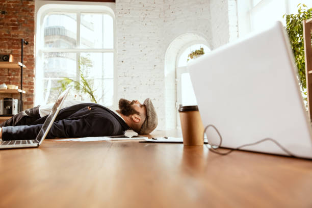 istock Businessman having fun dancing break dance in the office at work 1183352613