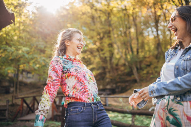 istock Two beautiful ladies in park 1183353176