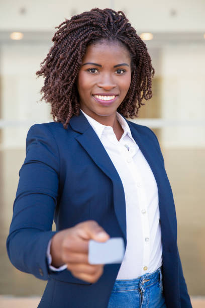 istock Happy successful consultant giving name card 1183353835