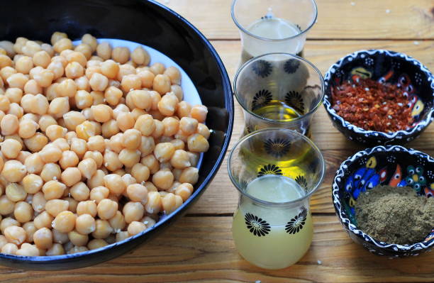istock Ingredients for hummus from chickpea with tahine 1183356111