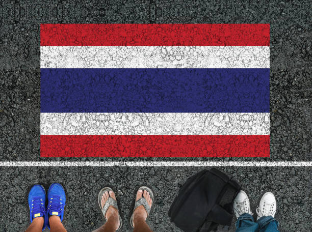 istock legs and flag of Thailand 1183356395