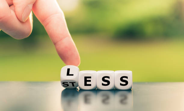 istock Having less stress or being stress-less. Hand turns a cube and changes the word 