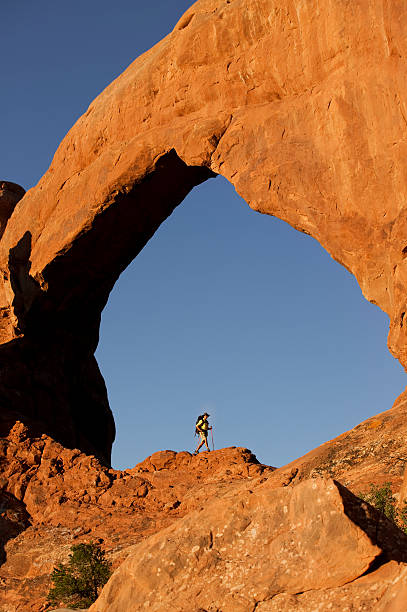 istock Hiking On Rocks Below Arch In Arches National Park, Utah 118336056
