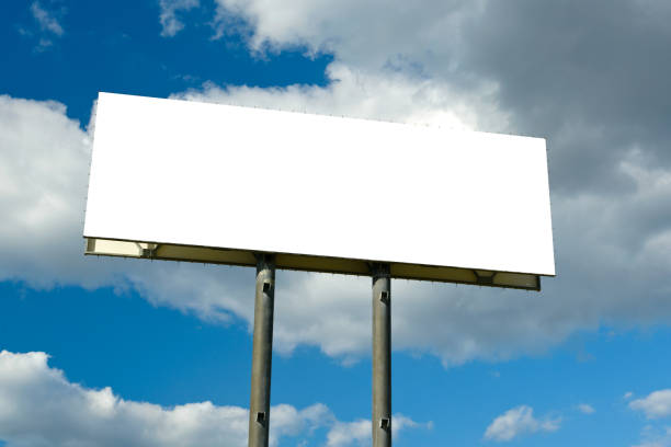 istock Empty billboard standing on a background of clouds and sky 1183363647