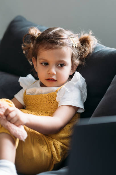 istock Little Girl Looking at Laptop 1183364283
