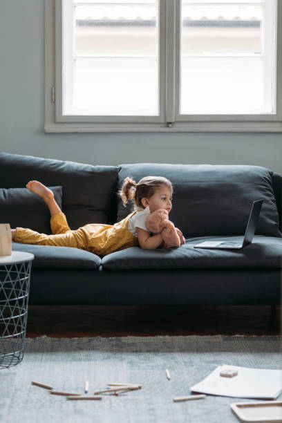 istock Little Girl Looking at Laptop 1183364286