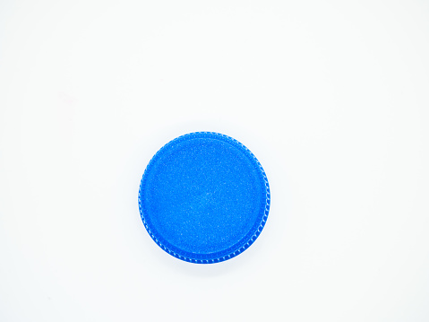 Blue plastic stopper on white background