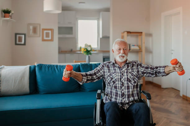 istock Senior Man in a Wheelchair using Dumbbells 1183364587