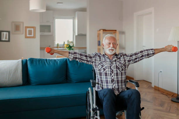 istock Senior Man in a Wheelchair using Dumbbells 1183364684